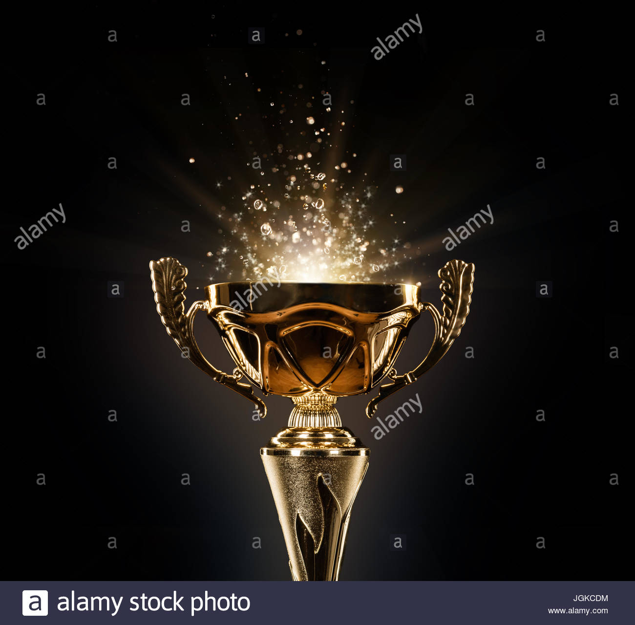 champion-golden-trophy-isolated-on-black-background-concept-of-success-JGKCDM.jpg